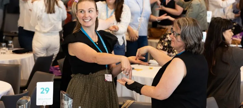 Women playing a game at a conference