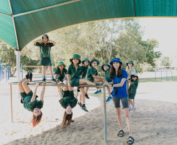 Anula OSHC children with educator at playground