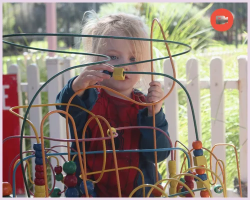 A baby playing with blocks