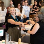 Women playing a game at a conference
