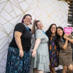 A group of women pose for a photo
