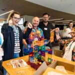 A group of people cheering and playing a game