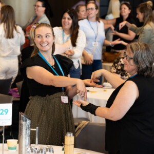 A group of people playing a game at a conference